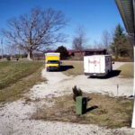 two delivery trucks fight for unload time